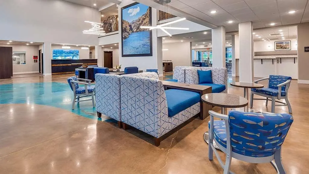 Best Western Plus lobby with blue seating and a polished concrete floor