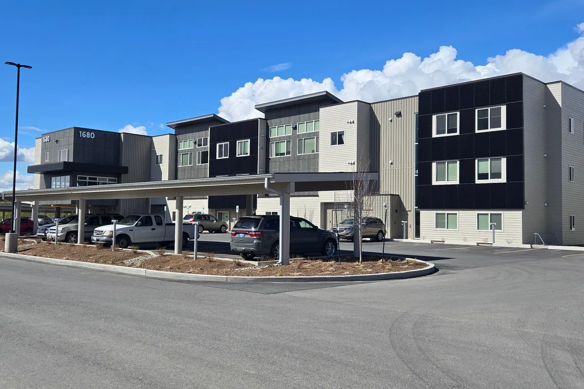 Aspen Housing three-story apartment buildings with covered parking in Wasilla, Alaska