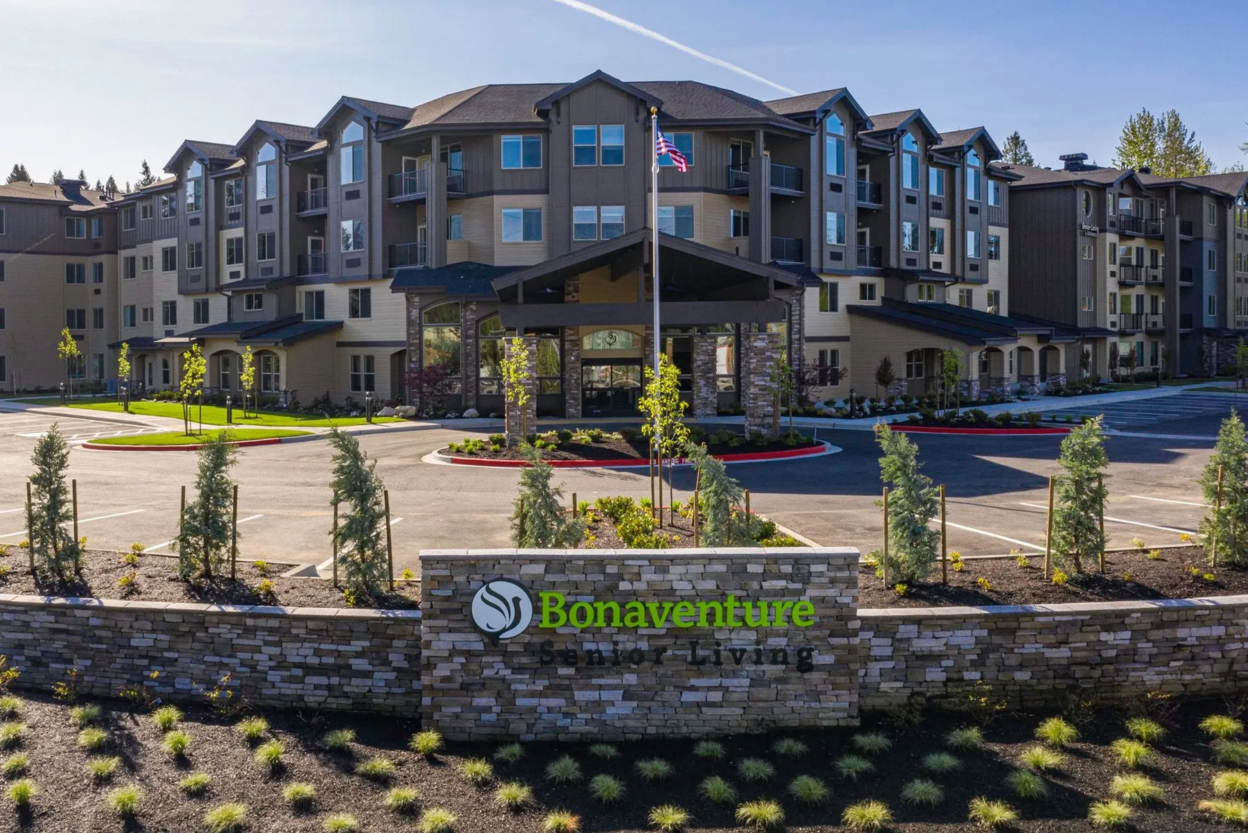 Bonaventure senior living community exterior with its stone entry sign and landscaping
