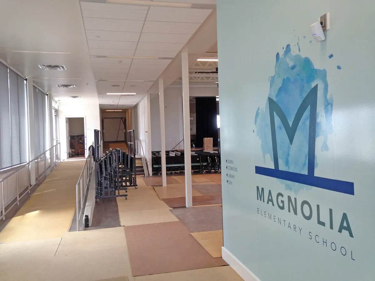 Magnolia Elementary School hallway with the school logo on a wall