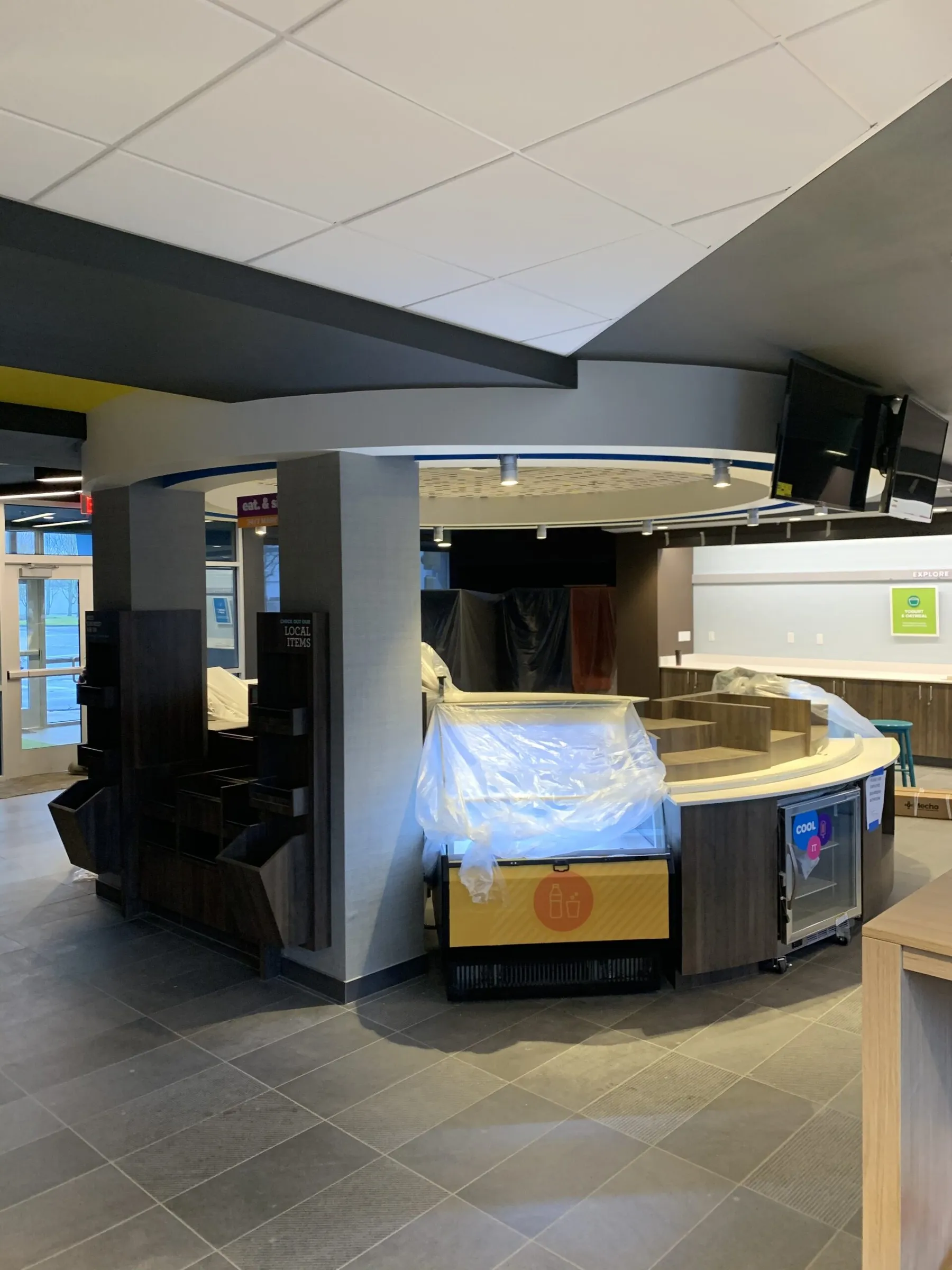 TRU by Hilton lobby interior near completion with a wrapped front desk