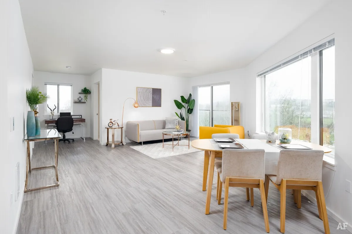 UPlace apartment living and dining room with large windows
